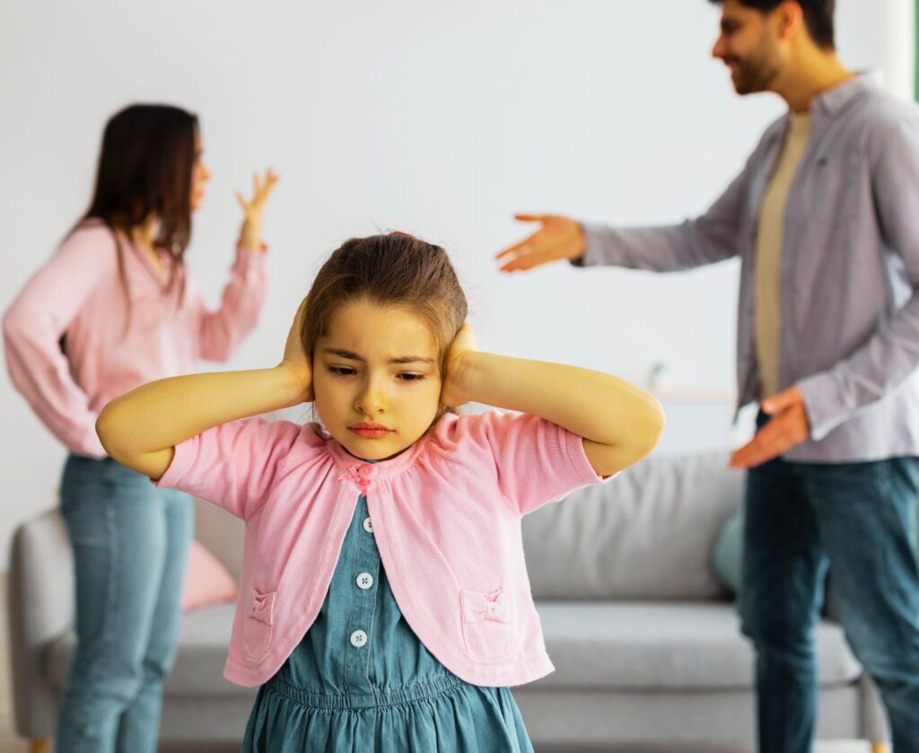 Image of couple fighting and a child scared